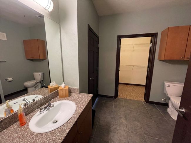 Bathroom featuring toilet, vanity, tile patterned floors, and baseboards | Image 17