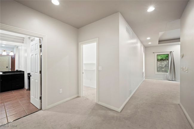 Hall featuring light colored carpet and recessed lighting | Image 21