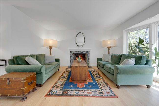 Living room with fireplace and bay window | Image 5