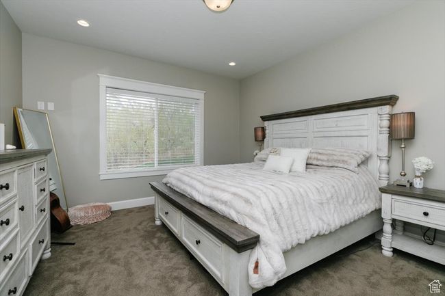 Bedroom with recessed lighting, dark colored carpet, and baseboards | Image 41