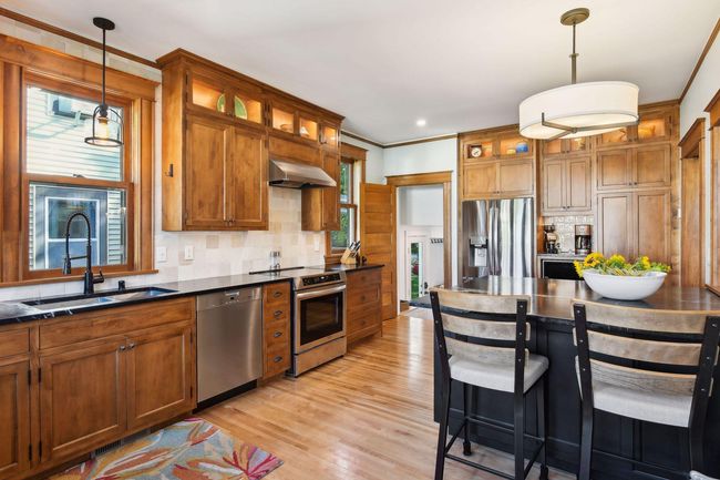 All new stainless steel appliances, coffee bar, and a large center island that provides space for casual dining. | Image 6