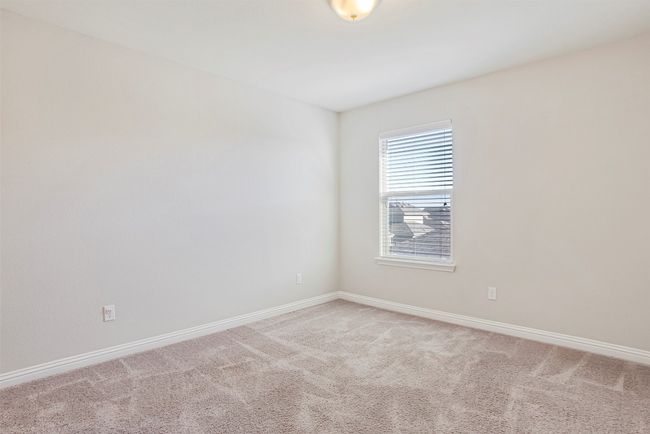 Carpeted spare room with baseboards | Image 26
