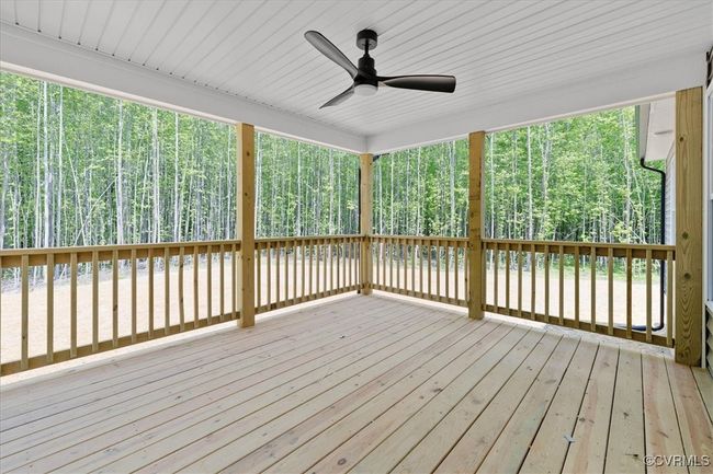 Wooden deck with a wooded view and ceiling fan | Image 16