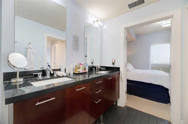 Bathroom featuring wood finished floors, double vanity, and ensuite bath | Image 18