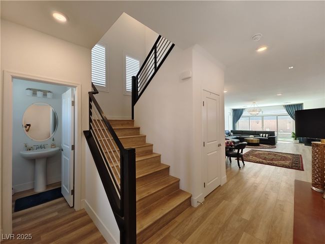 Entry-way of home with half bath for guests | Image 5