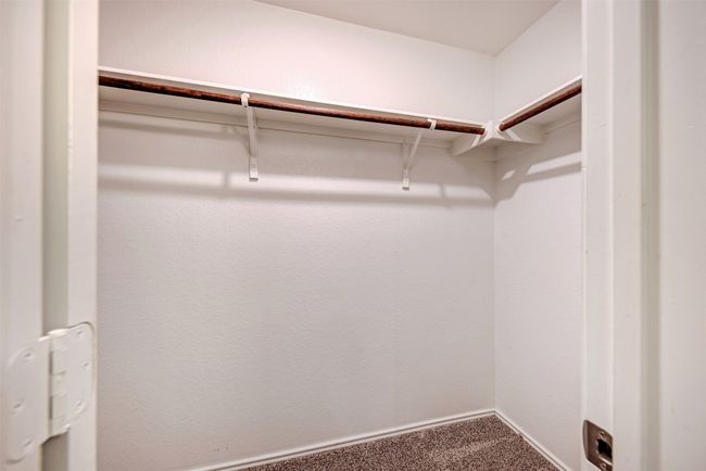 Walk in closet featuring carpet flooring | Image 21