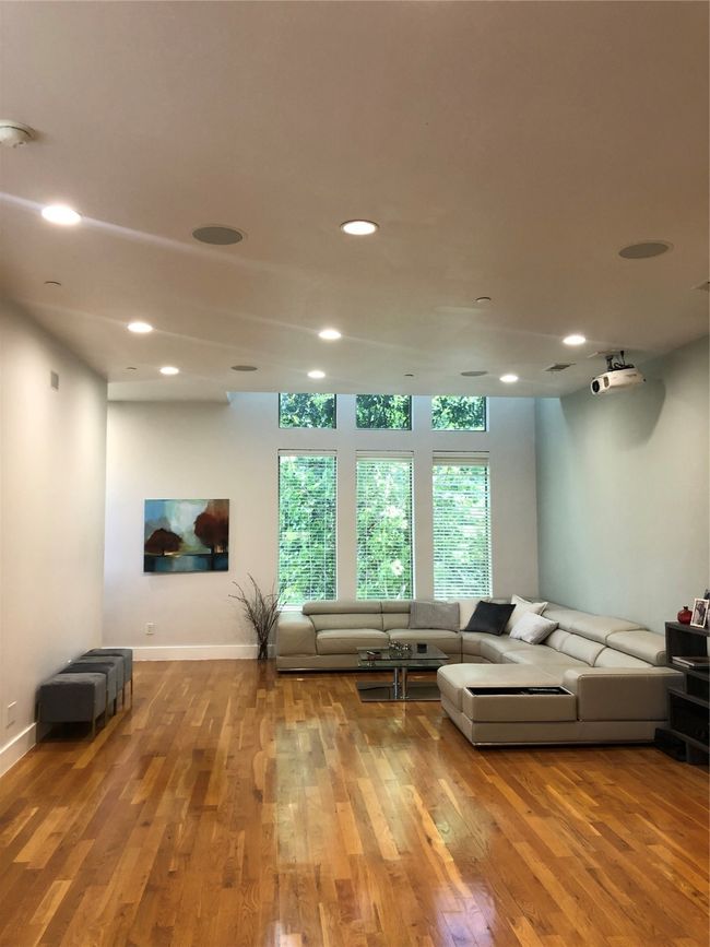 Living room with wood finished floors and recessed lighting | Image 5