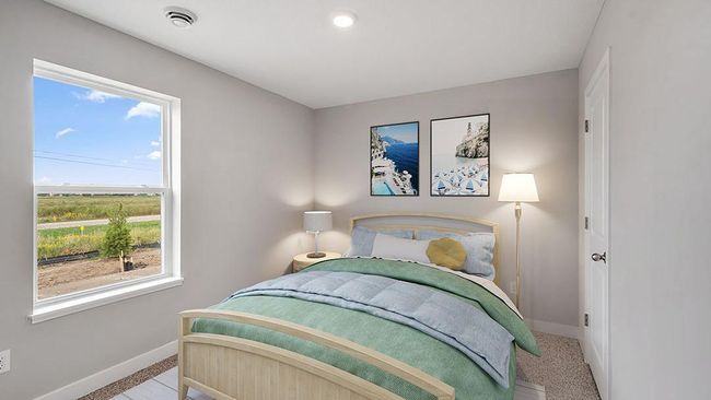 The second bedroom is spacious and perfect for guests, an office, den or hobby room! Photo of actual home! | Image 9