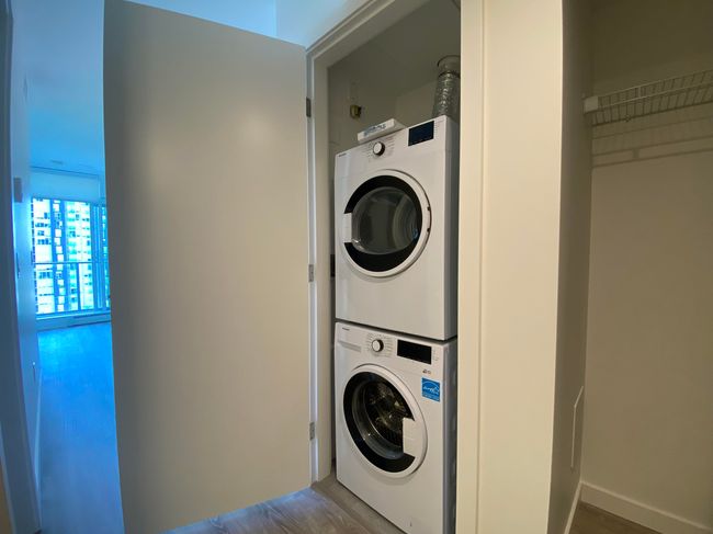 Laundry area with stacked washer / dryer and laundry area | Image 7