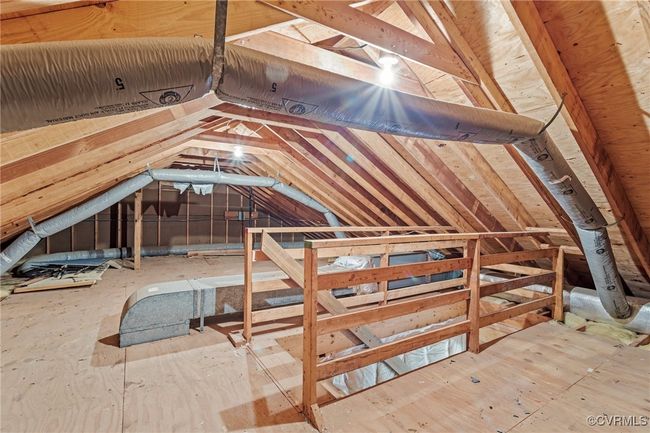 Unfinished attic featuring an upstairs landing | Image 30
