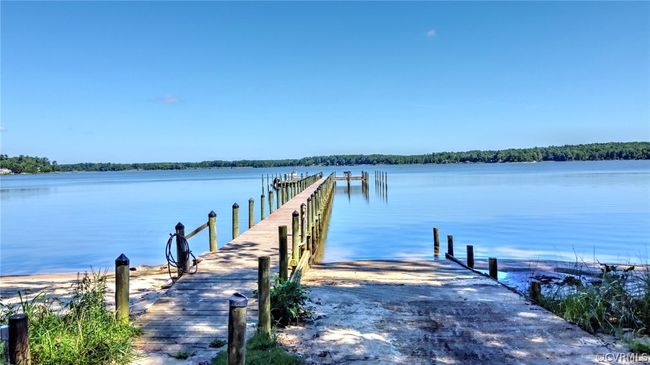 Dock area featuring a water view | Image 13