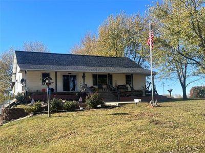 Single story home with covered porch and a front yard | Image 2