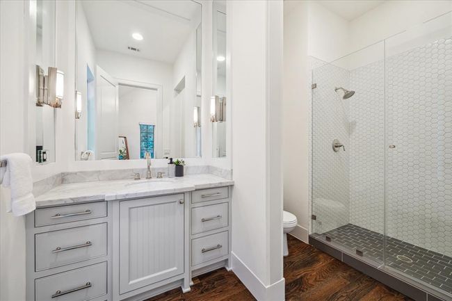 BATHROOM TWO. With vanity area and walk in shower. | Image 24