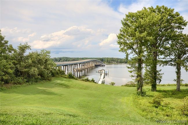 View of dock featuring a lawn and a water view | Image 22