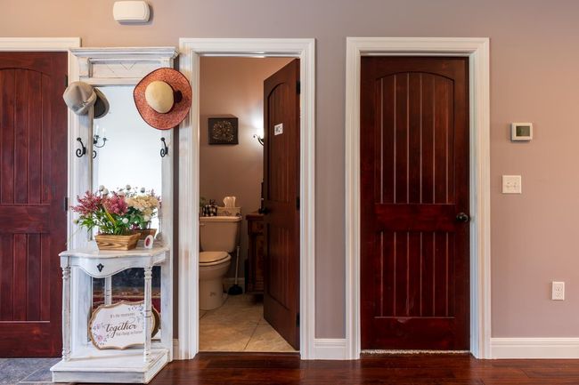Interior space with baseboards and wood finished floors | Image 13