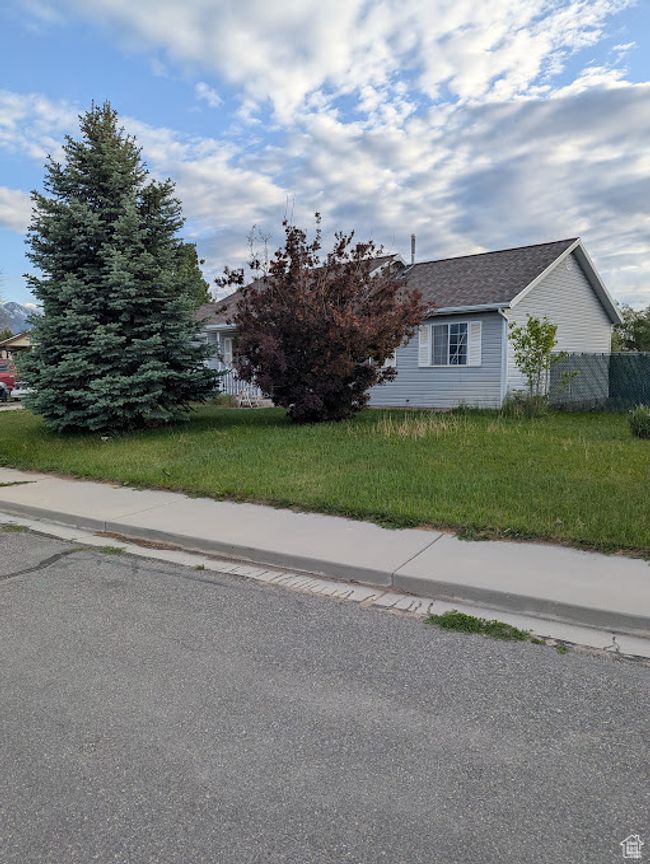 View of property exterior featuring roof with shingles | Image 22