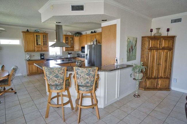 Family room opens to the Kitchen & Dining | Image 13