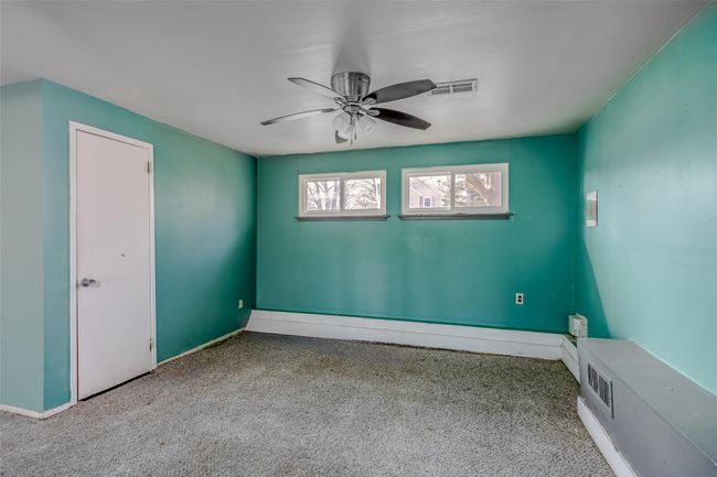 Spare room with carpet floors, ceiling fan, visible vents, and baseboards | Image 24