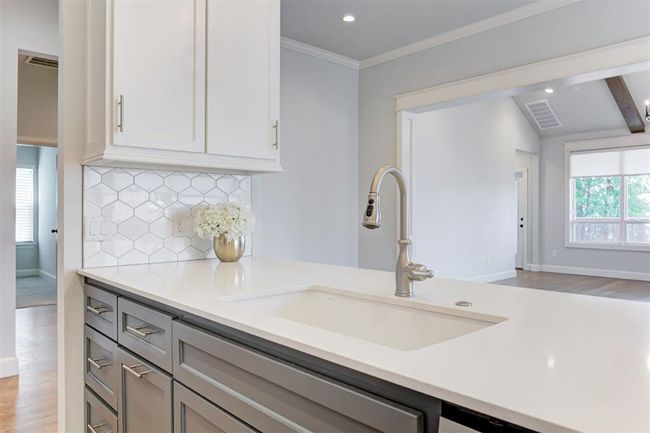 In-island sink on the kitchen island. | Image 12