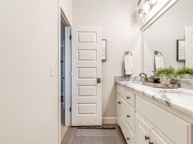 Bathroom featuring vanity and baseboards | Image 17