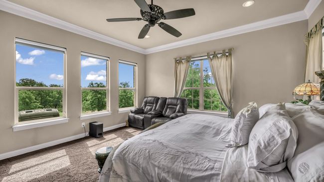 Bedroom with baseboards, recessed lighting, crown molding, and ceiling fan | Image 22