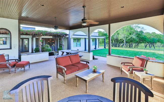 View of patio / terrace with an outdoor living space and a ceiling fan | Image 5