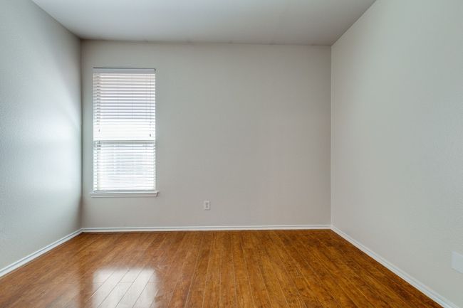 Spare room featuring wood finished floors and baseboards | Image 18