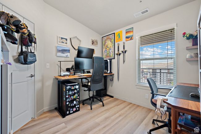 Home office with light wood-style flooring and baseboards | Image 14