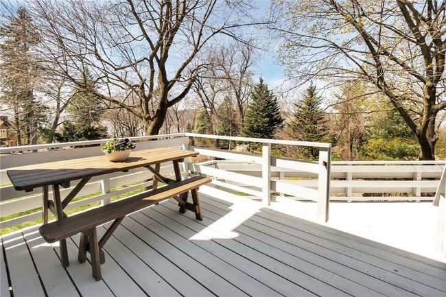 Deck off the family room and dining room over looks the rear yard with Hudson River views. | Image 16