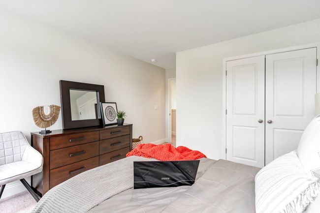 Bedroom featuring a closet and baseboards | Image 29