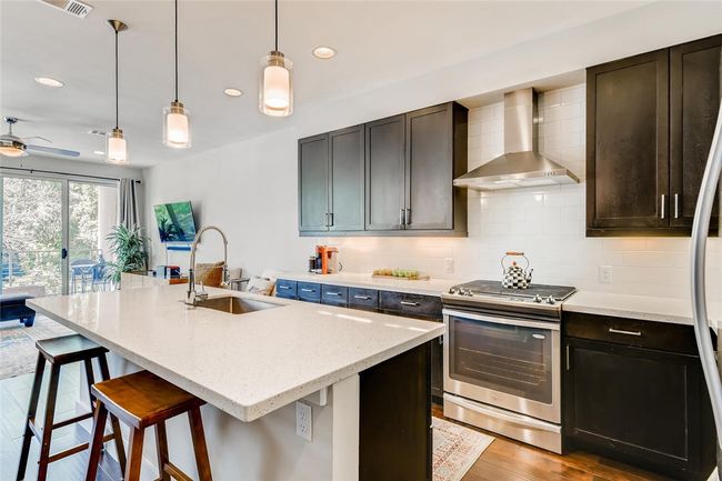 Open kitchen with quartz island and counter tops | Image 9