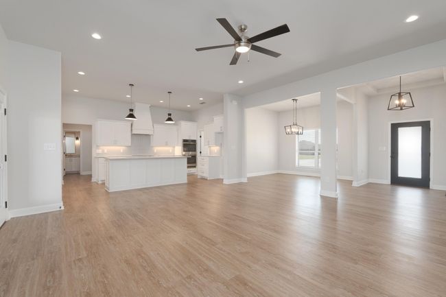 Unfurnished living room featuring recessed lighting, light wood-style flooring, and baseboards | Image 8