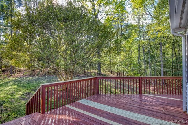 Wooden terrace featuring a lawn | Image 17