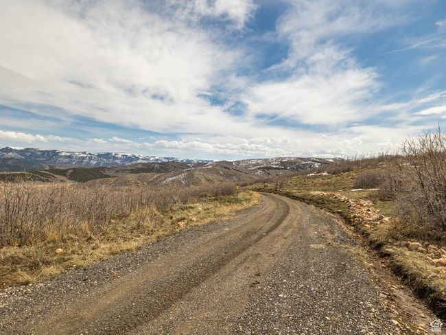 View of street featuring a mountain view | Image 4