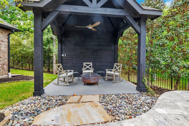 Just imagine all the ways you can use this amazing poolside cabana! Not just for a separate firepit, but it could be a place for comfy deck chairs to relax on, or an outdoor eating area, or perhaps even a peaceful spot for yoga or meditation! | Image 33