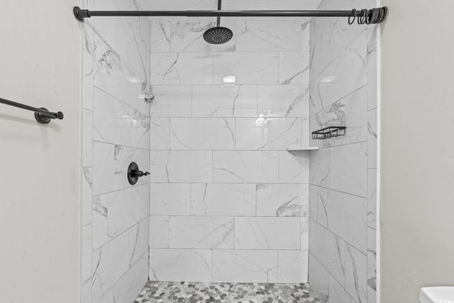 Full bath featuring a tile shower | Image 25