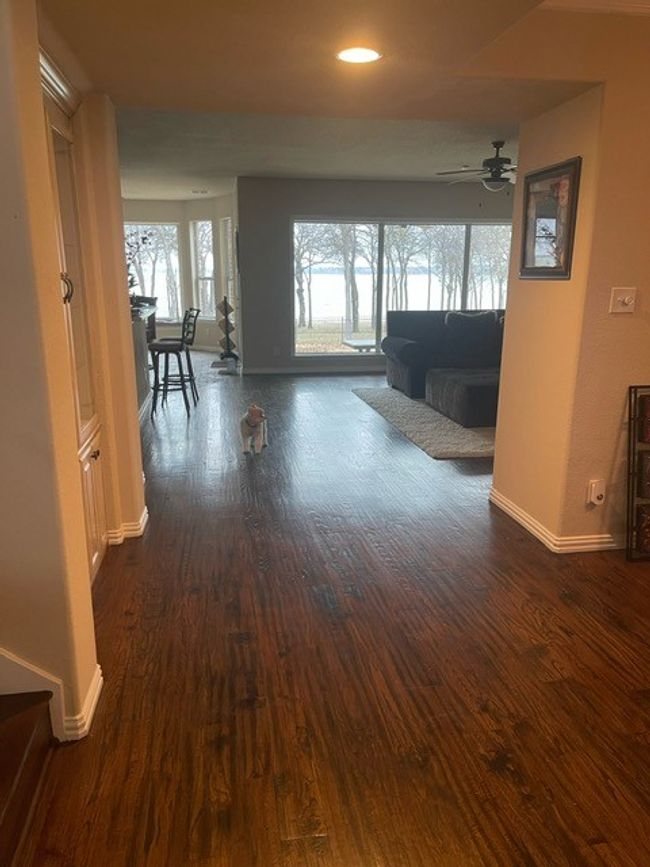 Hallway featuring dark wood-type flooring, baseboards, and recessed lighting | Image 8