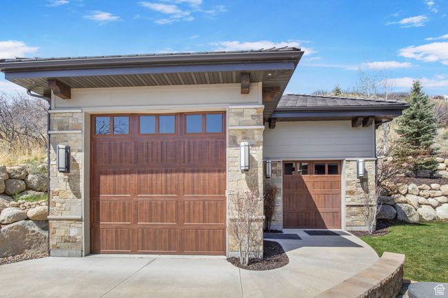 Garage featuring driveway | Image 120