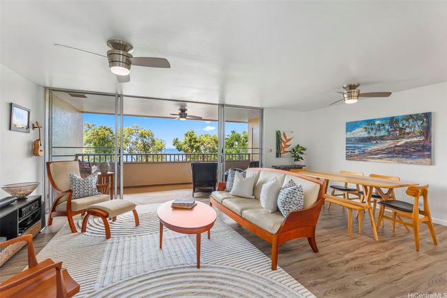 A spacious covered lanai off the living room is perfect for indoor/outdoor living. | Image 6