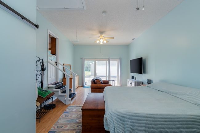 Suite with sliding patio doors out to the patio | Image 19