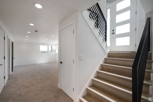 Stairs with recessed lighting, carpet, and baseboards | Image 6