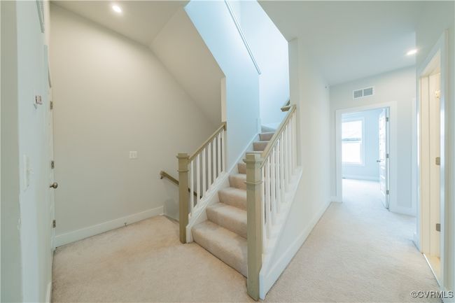 Stairway with carpet flooring, recessed lighting, and baseboards | Image 25