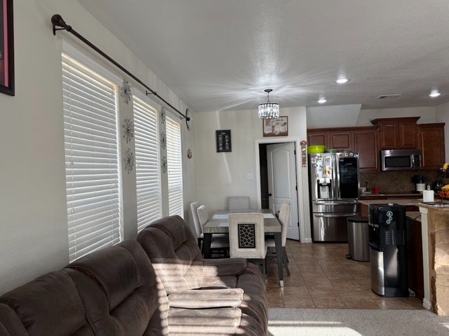 Side view of living area, overlooking the dining and kitchen. | Image 15