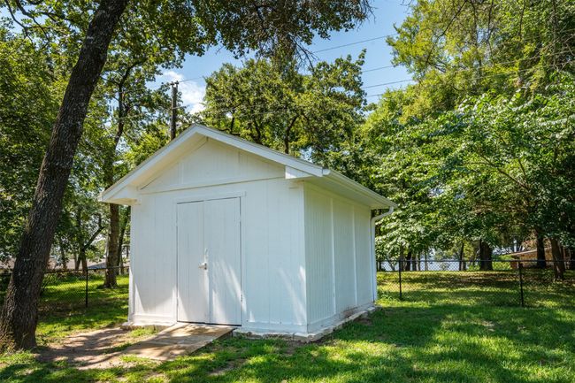 View of outdoor structure featuring a yard | Image 23
