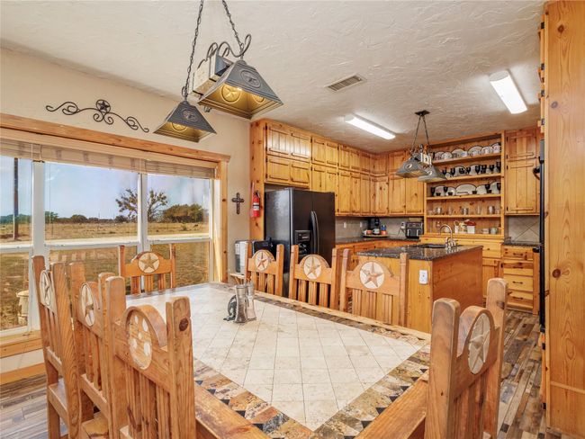 Picture window in dining offers lots of natural light | Image 8