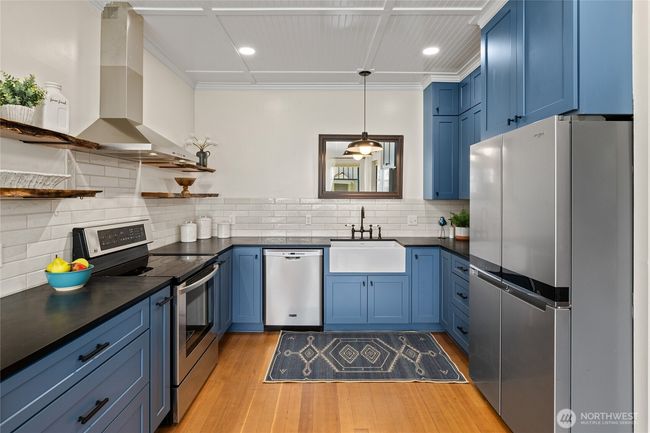 The remodeled kitchen marries modern conveniences with classic style, preserving the home’s character while offering up-to-date amenities. | Image 11