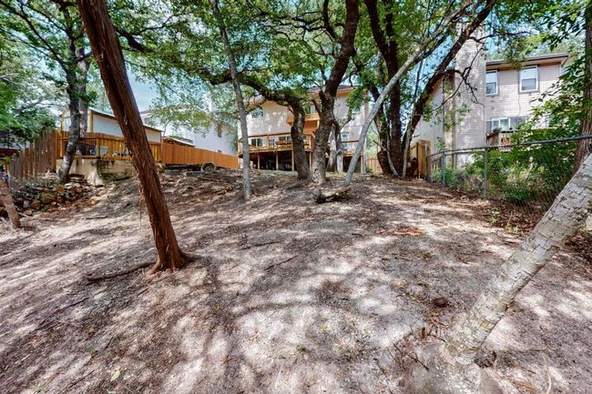 View of yard featuring a wooden deck | Image 37