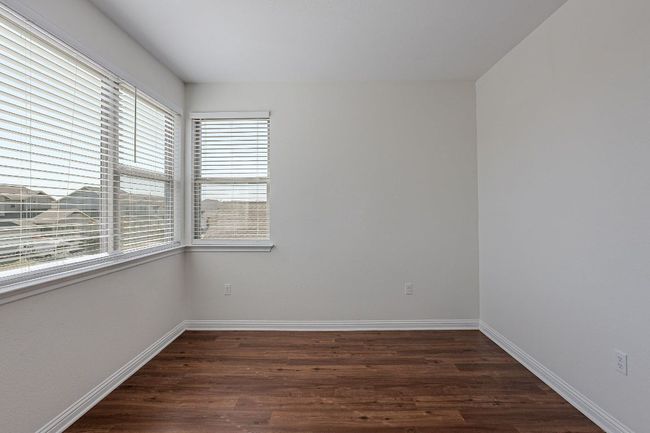 Empty room featuring dark wood-style floors and baseboards | Image 23