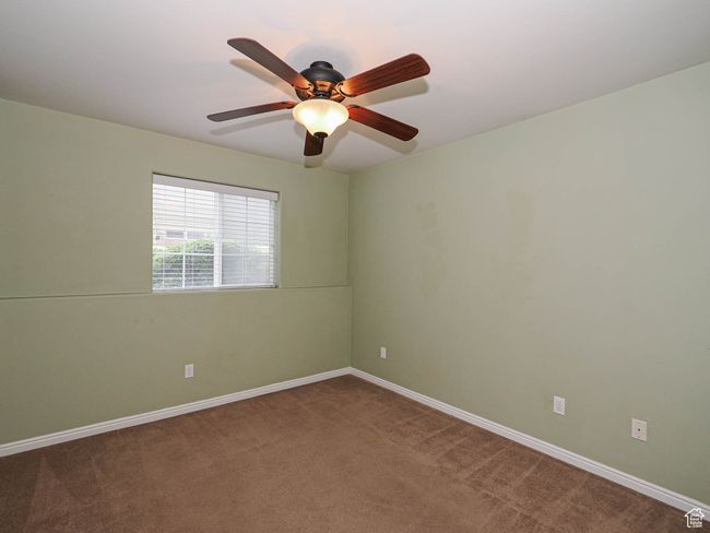 Empty room featuring baseboards, a ceiling fan, and carpet floors | Image 15