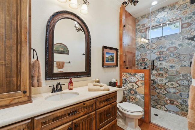 The "Tuscan" Full Bath Ensuite features "Rustic Cotto" 13"x13" porcelain tile flooringby Merola Tile. Custom-designed and crafted vanitycabinetry. | Image 33